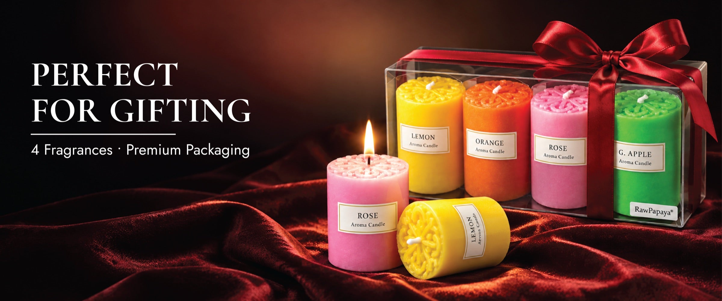 A colorful RawPapaya candle gift set with premium packaging.