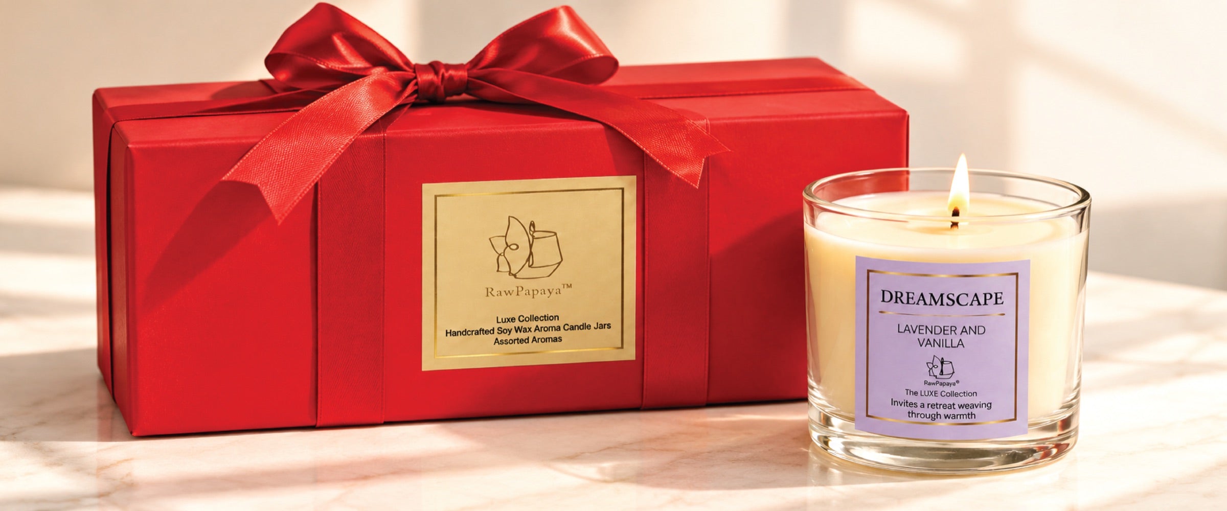 A RawPapaya candle presented in a red gift box.